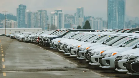 A line of used cars ready for sale.